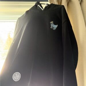 Men's Black Hoodie with Embroidered Cartoon Design